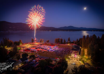 aerial of Festival at Sandpoint fireworks and moon over lake